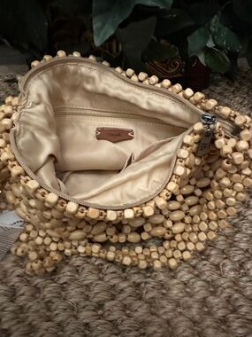 The Sak Beaded Straw Wristlet in Natural Beige